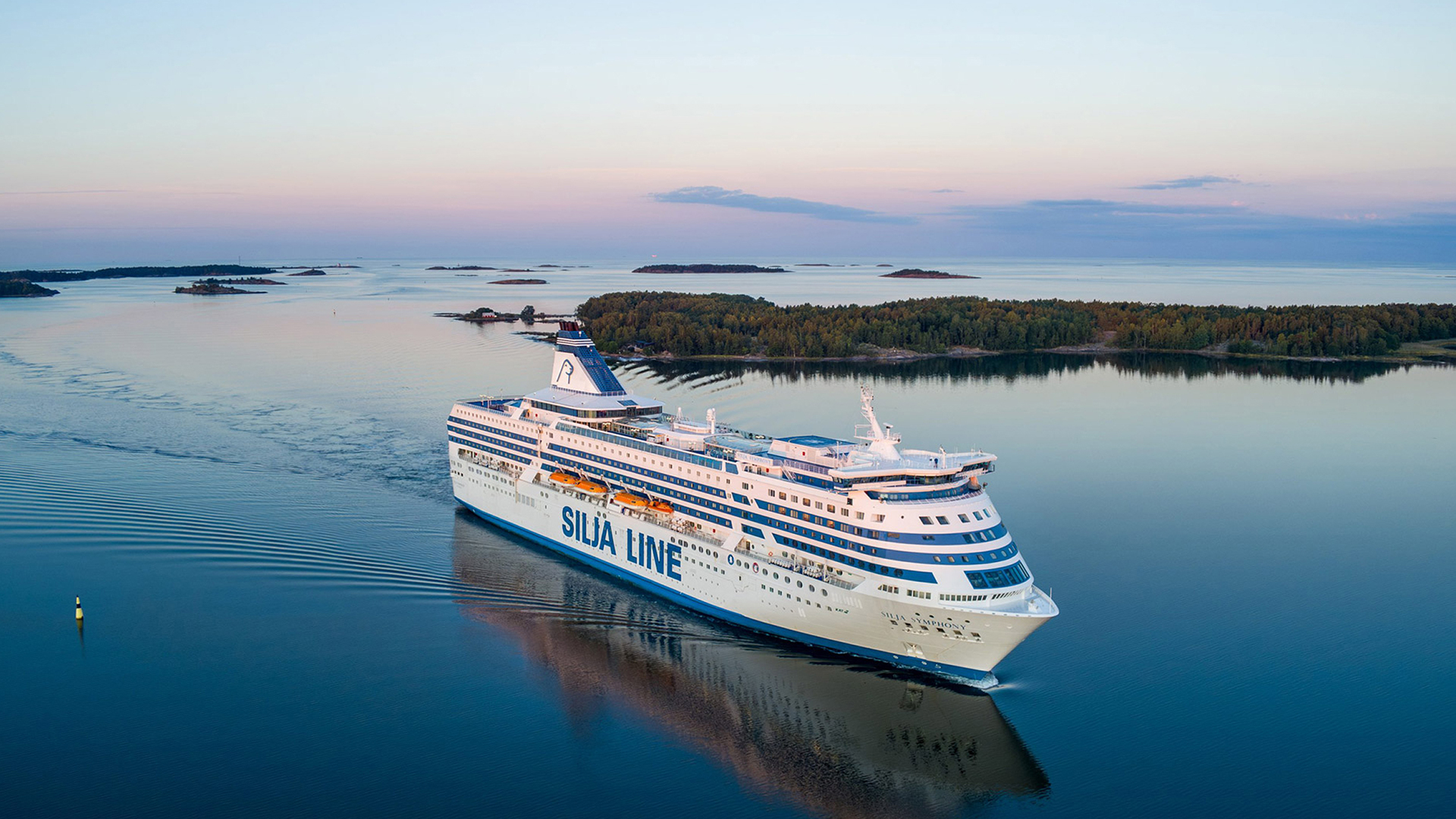 Tallink Silja Line cruise ferry sailing through the Stockholm archipelago at sunset, operating daily between Helsinki, Turku and Stockholm.