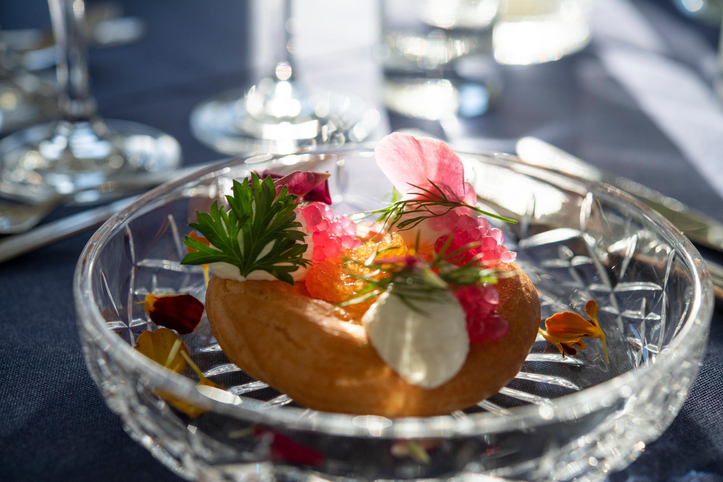 A starter off roe on a paté a choux with lemon and horseradish cream and dill.