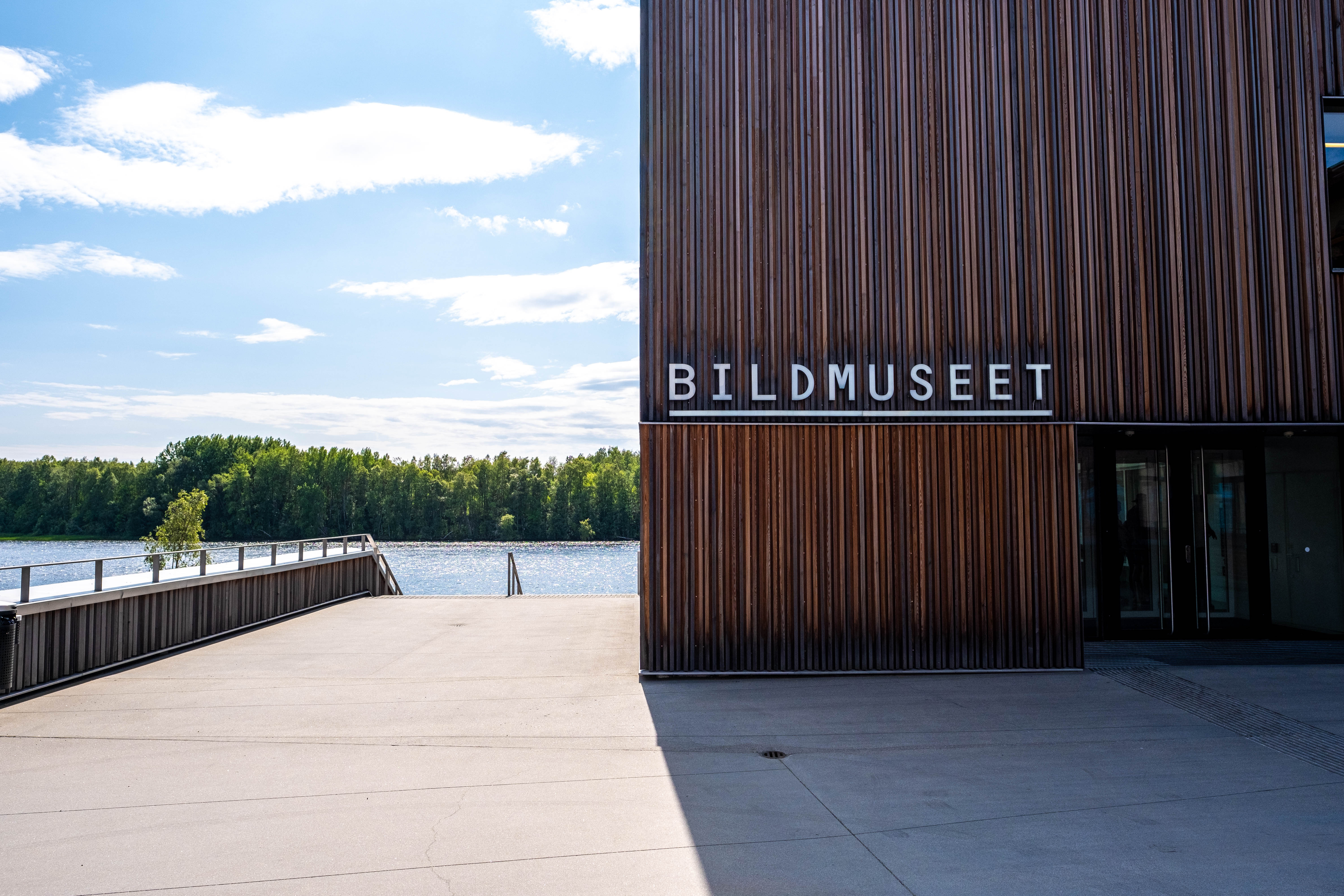 The entrance to Bildmuseet in Umeå, a contemporary art museum with a wood-clad façade overlooking the Ume River.