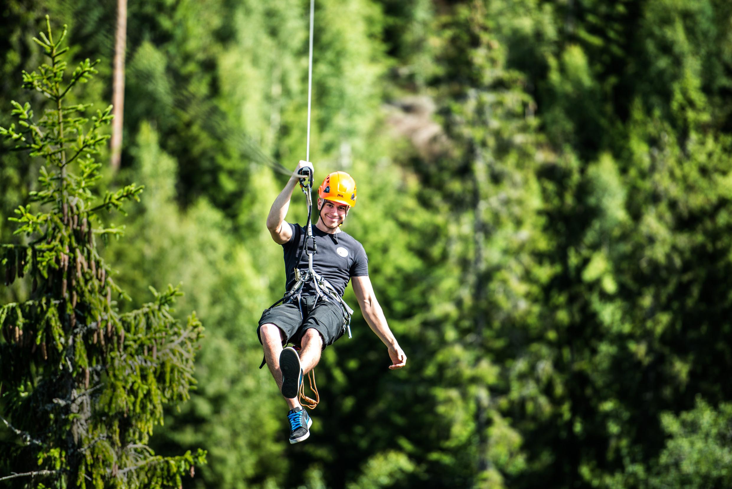Man doing zipline in Småland