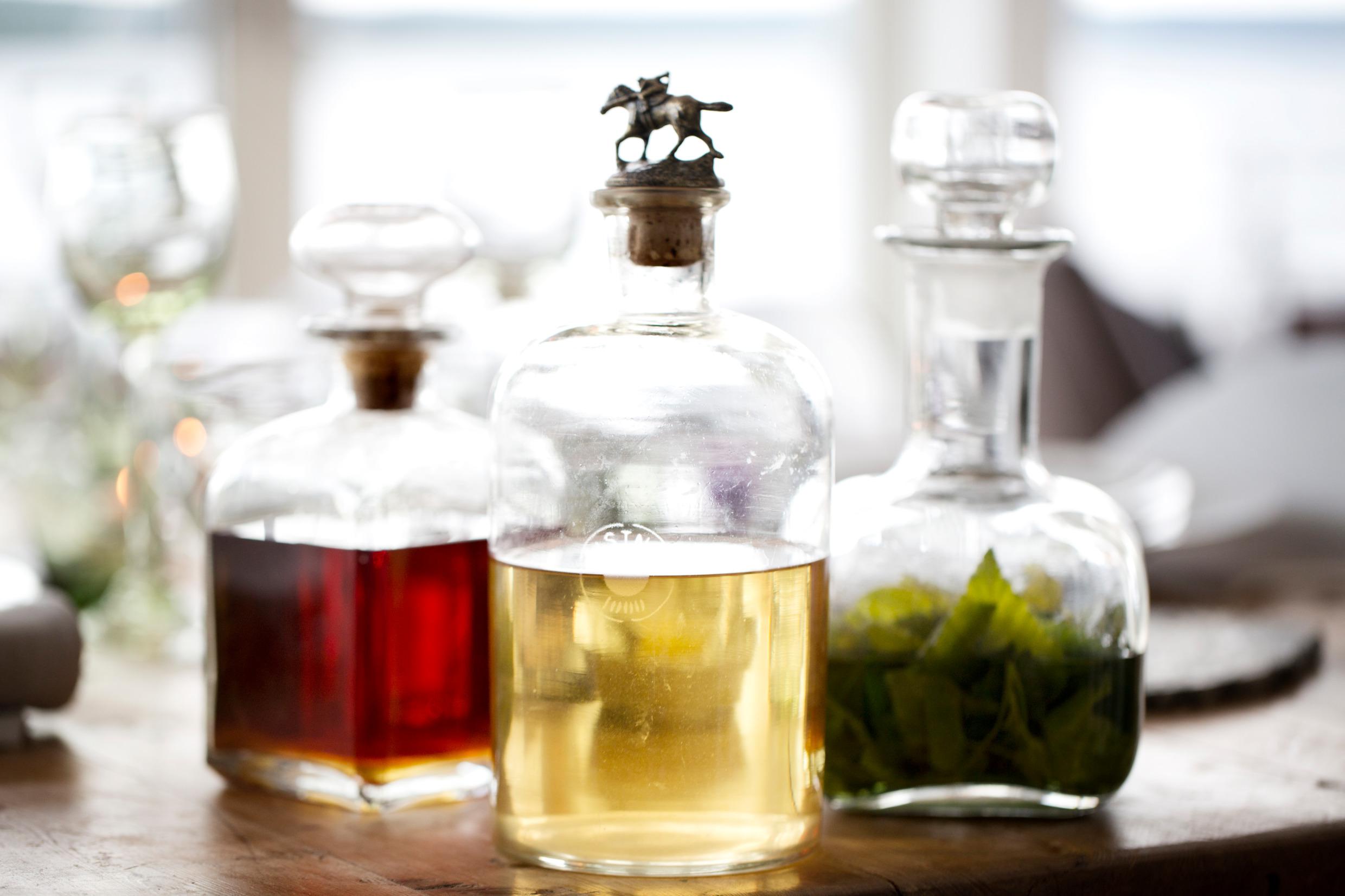 Bottles of home-made hard liquor with different infusions.