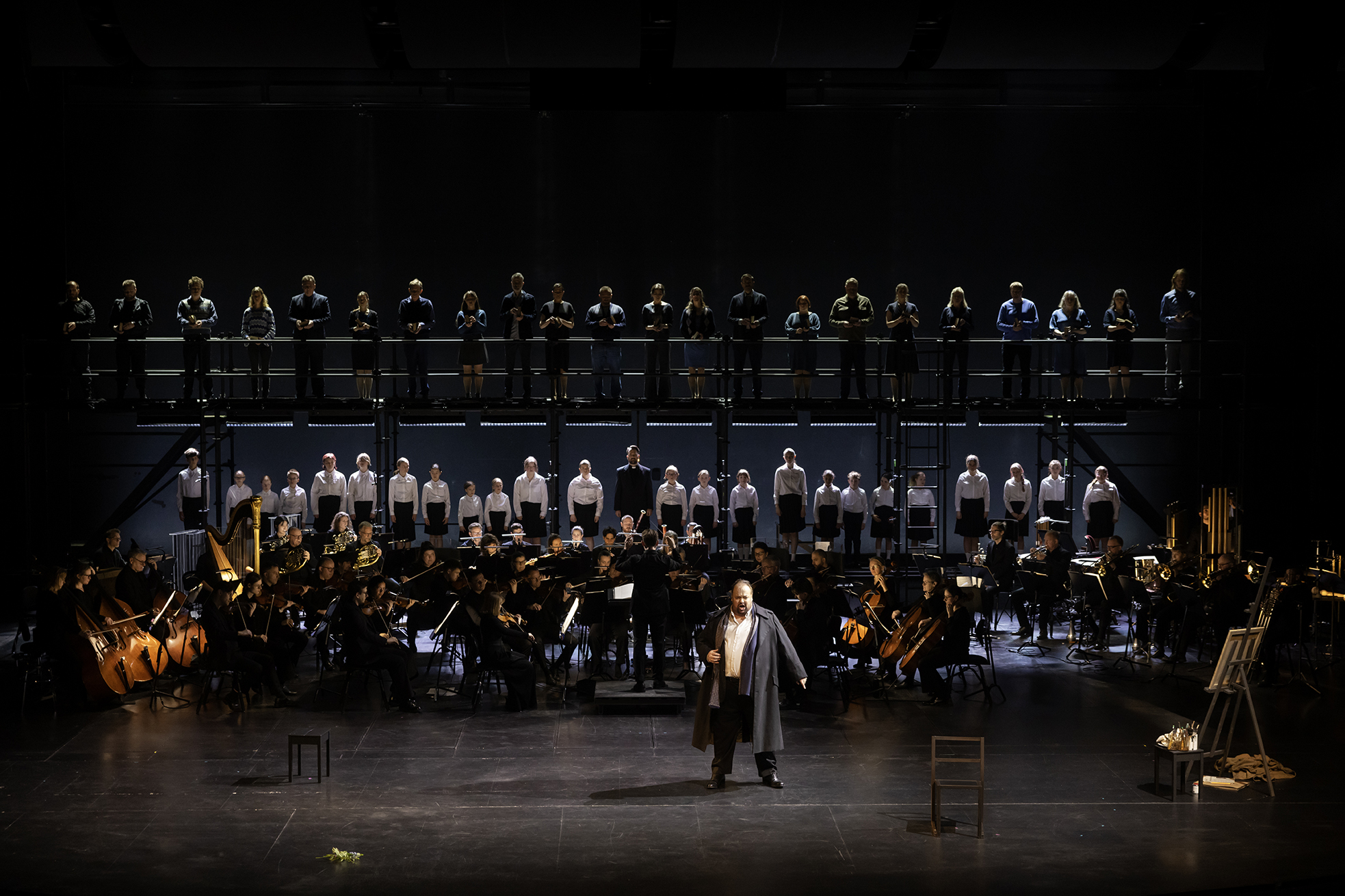 An opera performance at Norrlandsoperan in Umeå, with soloists, orchestra and choir performing on stage.