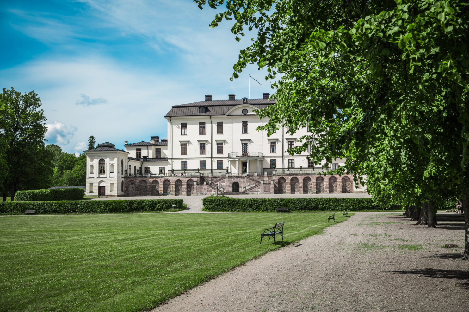 Rosersberg Palace, surrounded by greenery and its historic park landscape.