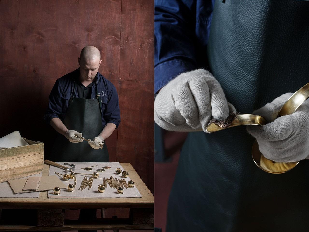 Several brass parts lie on a table in front of a man who is working on assembling the parts. A close up of his hands polishing a brass candlestick.
