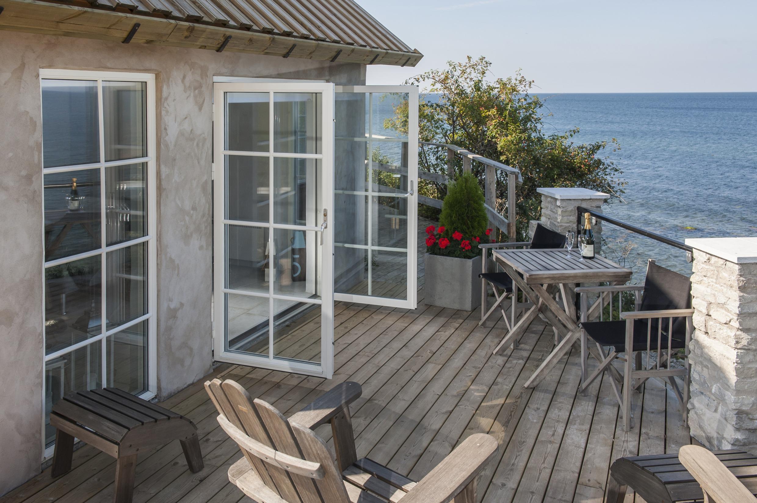 An inviting cottage with open windows at the Baltic sea.