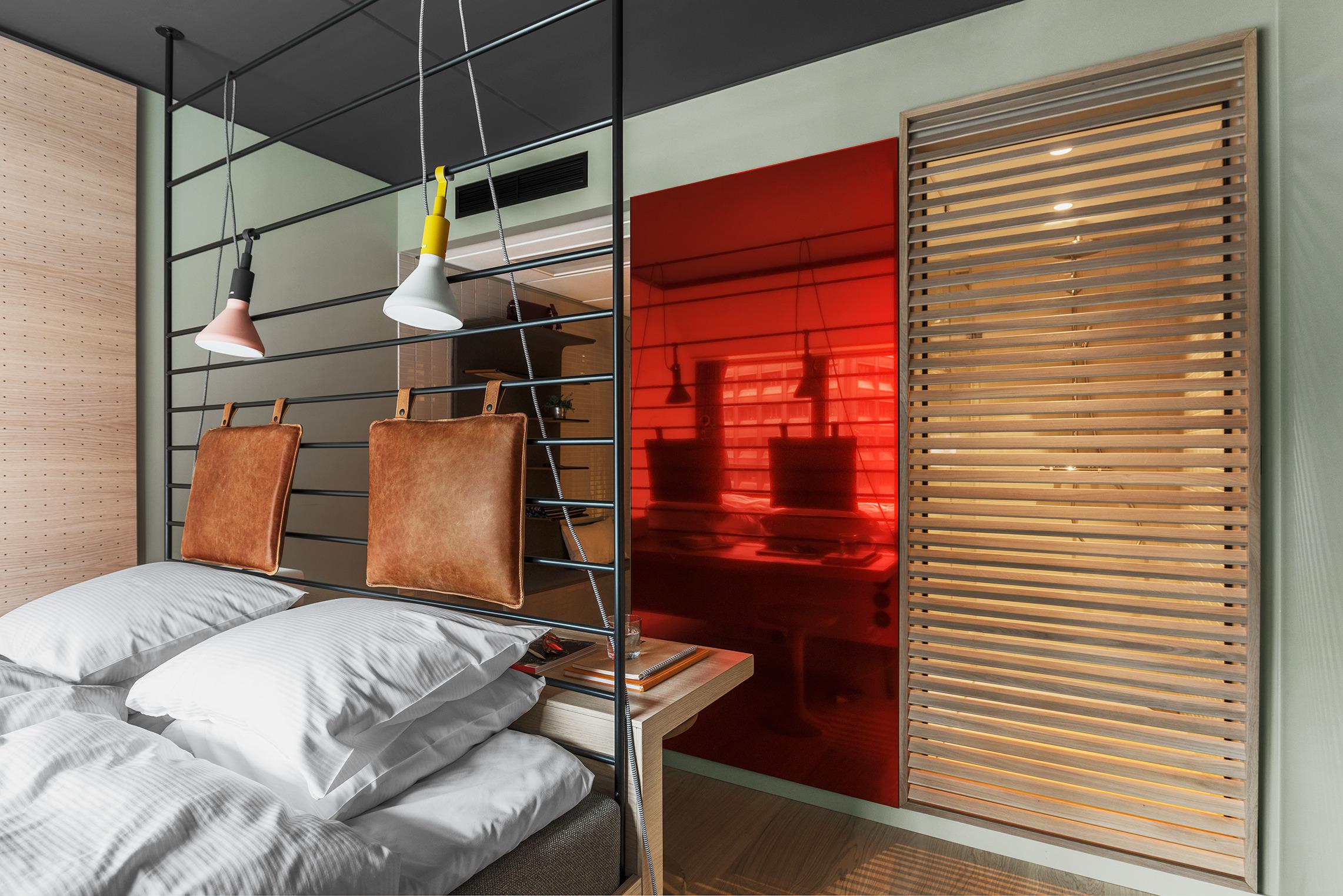 A double bed with white sheets in a hotel room.