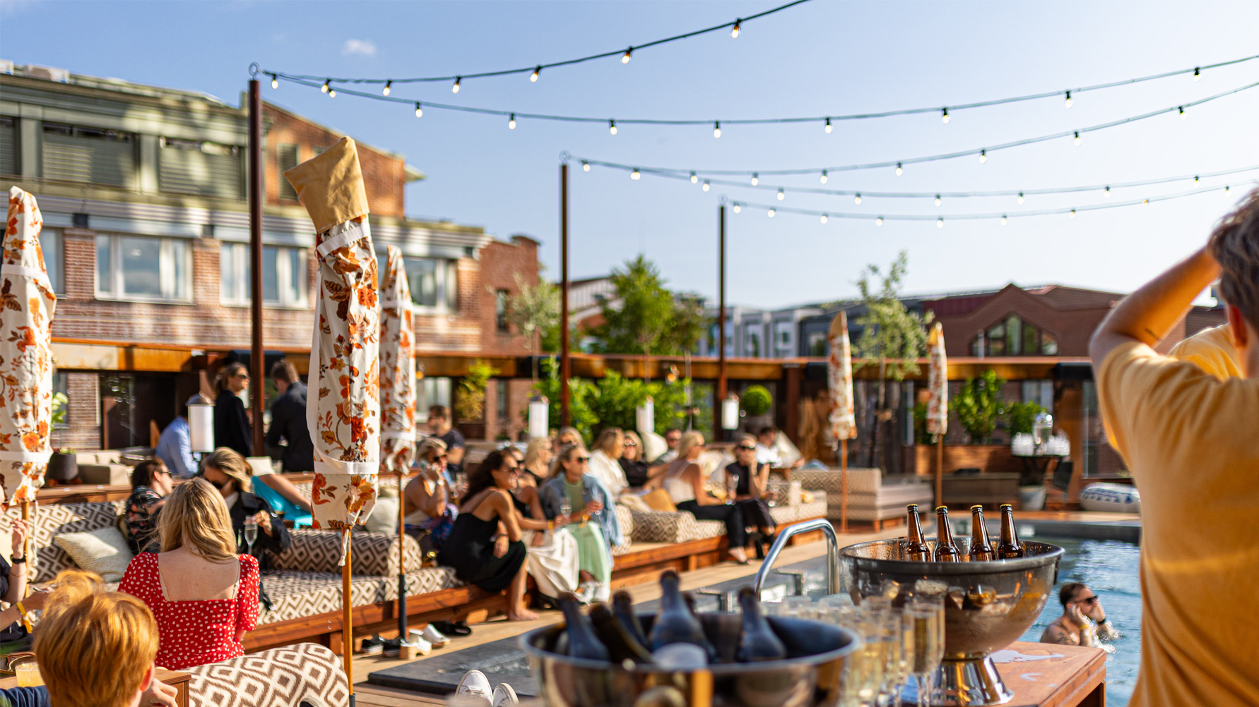 Guests relaxing by the rooftop pool at Jacy’z Hotel in Gothenburg.