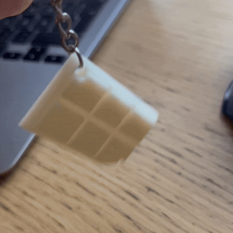 GIF på produkten: Nyckelring Choklad Rutor Med Tugga - Nyckelring / Nyckelkedja Ingår