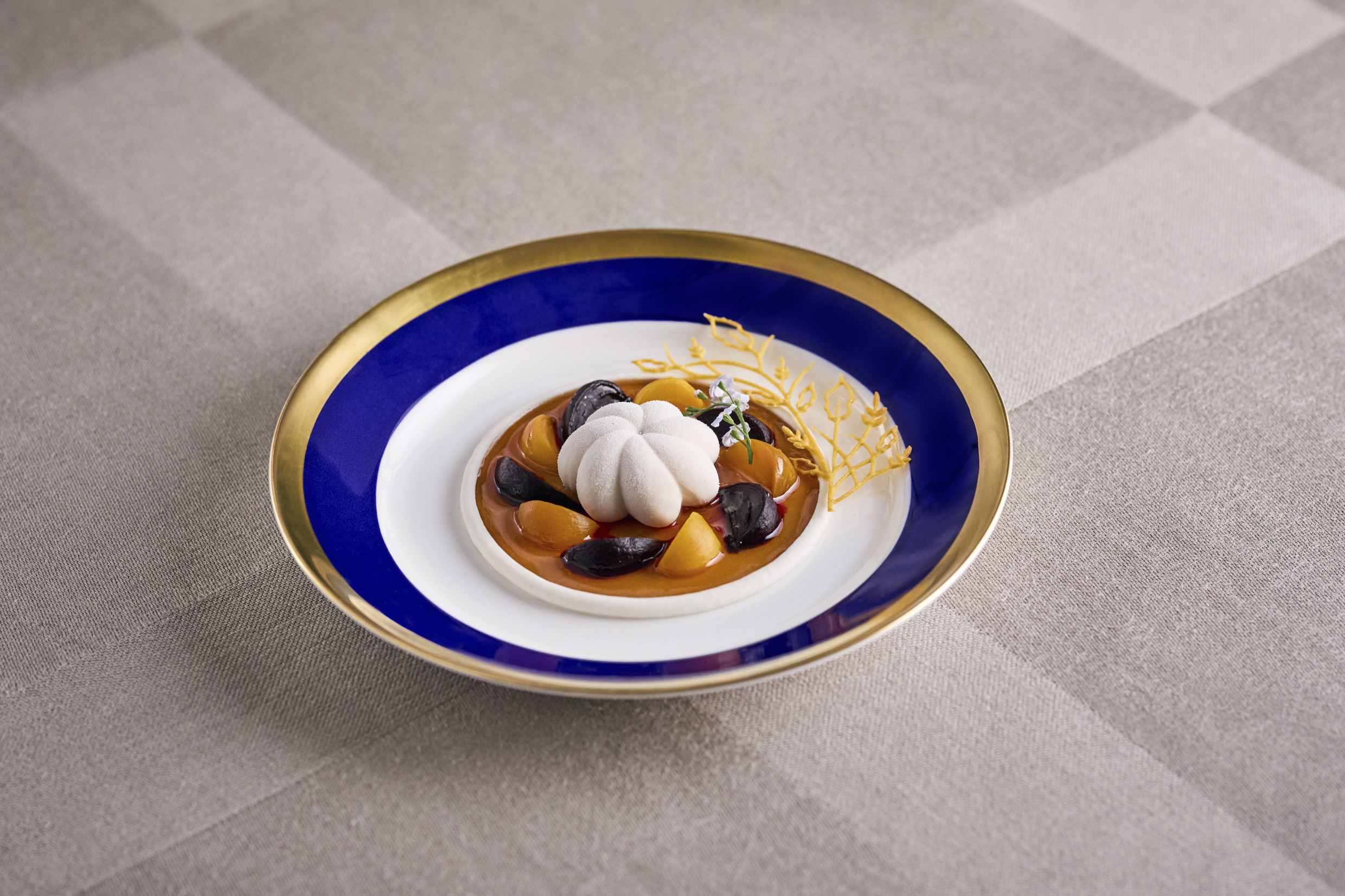 Nobel starter served on blue-rimmed porcelain plate.