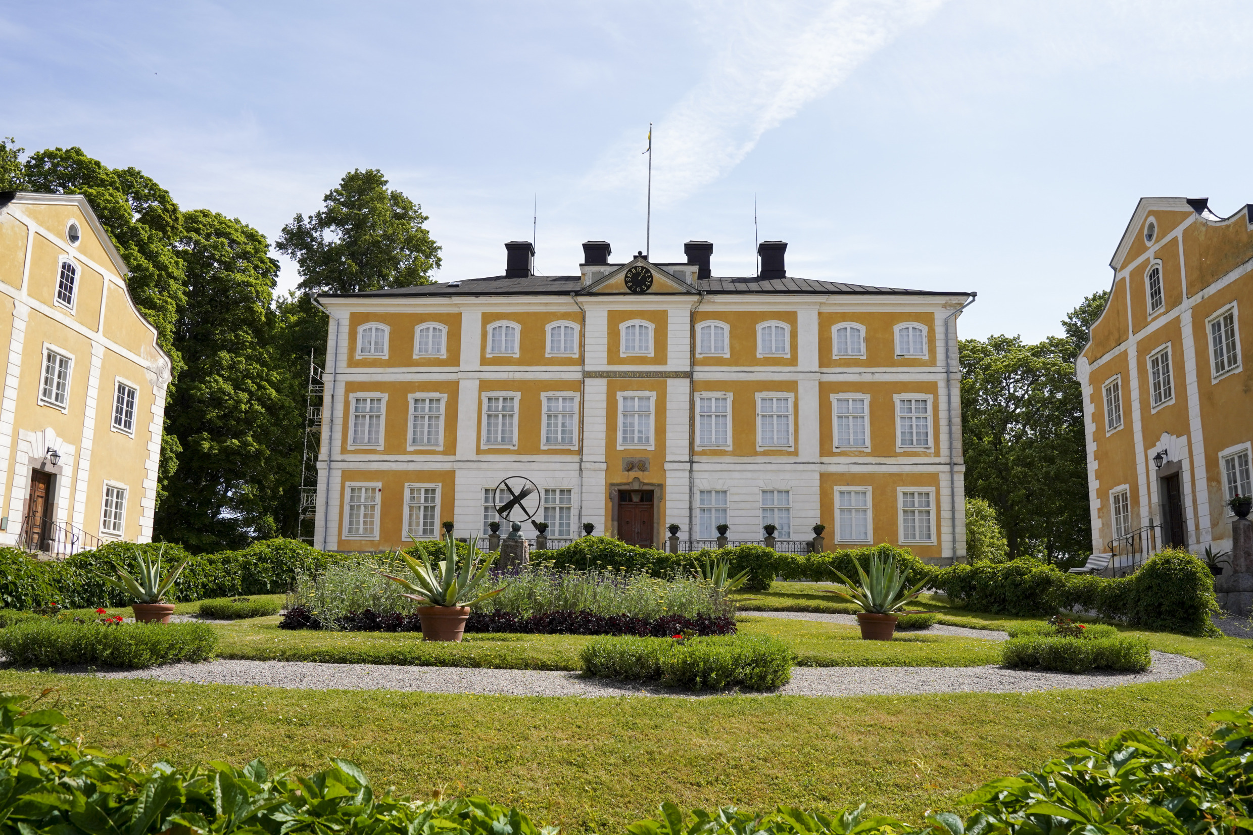 The yellow main buildings at Julita Manor.