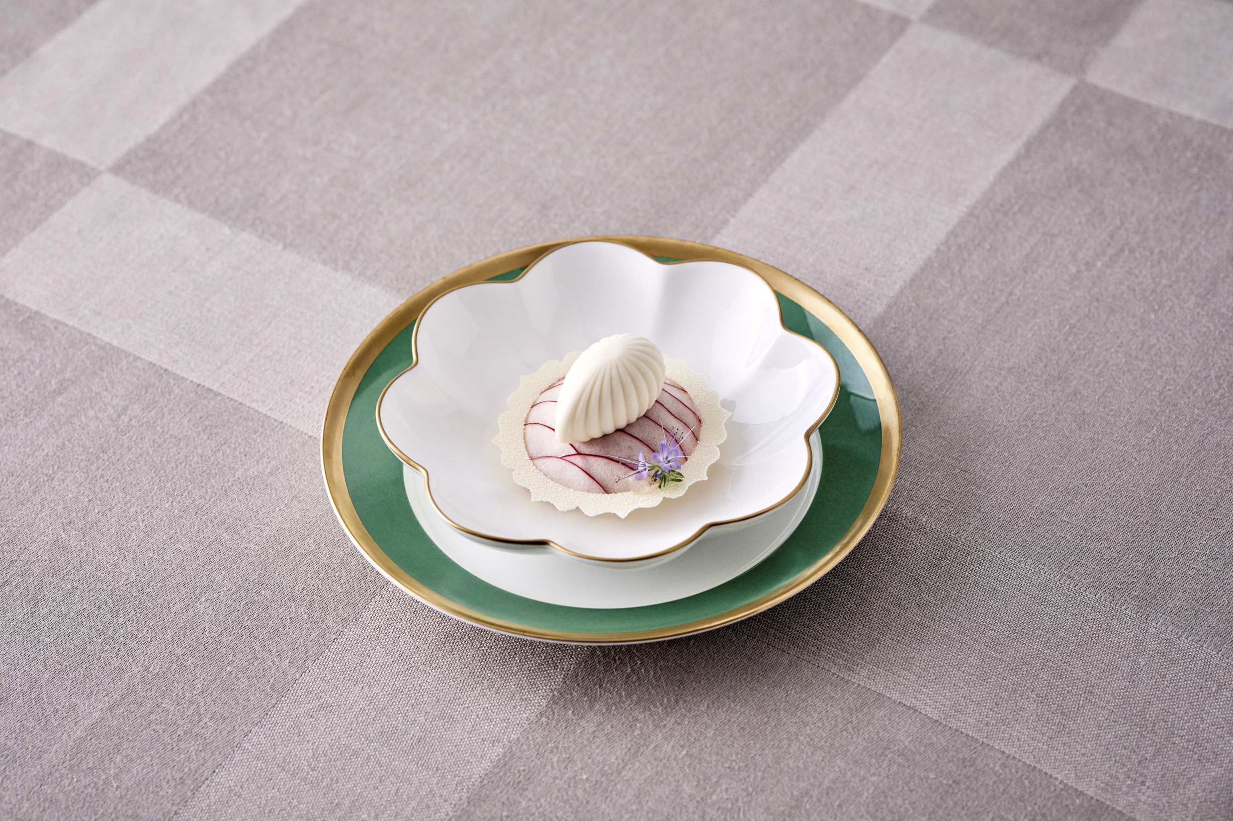 Dessert on green-rimmed Nobel plate.