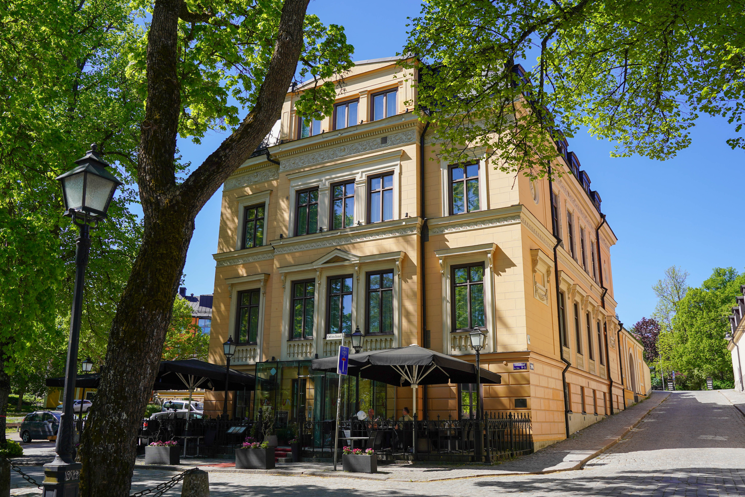 Outside view of Villa Anna and restaurant with outdoor seating.